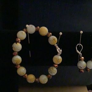 This bracelet is 8 and 1/4 inches long.Earrings are 1 and 1/2 inches long.